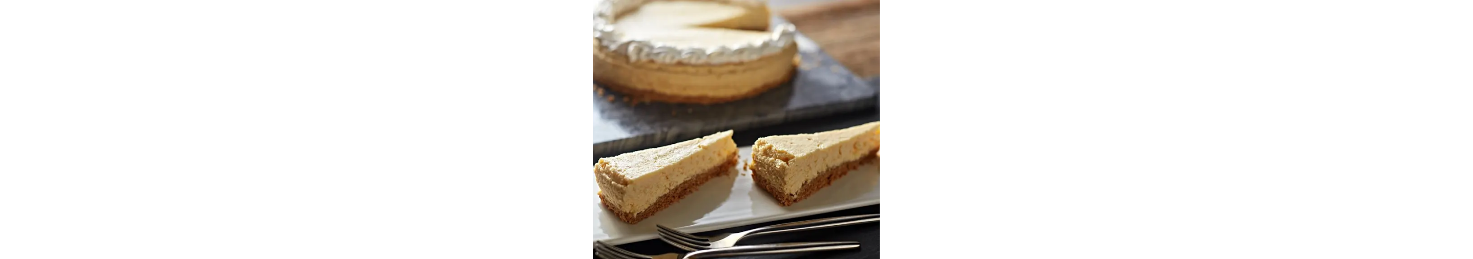 Cheesecake with two slices on platter
