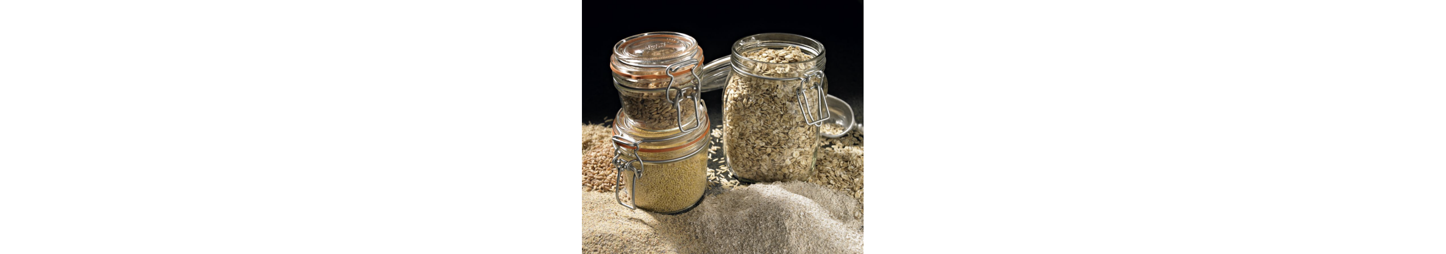 Three jars filled with grains and different spices