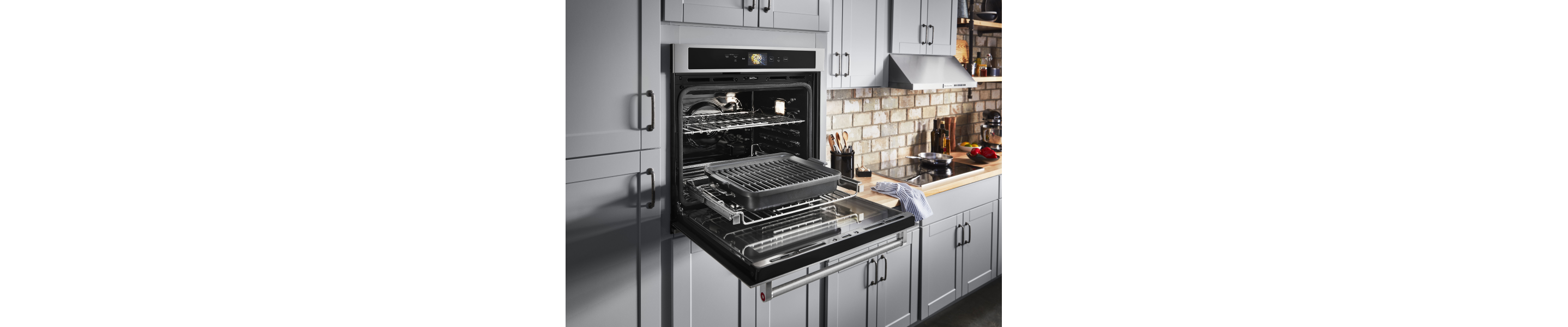 Open KitchenAid® wall oven with Powered Attachment