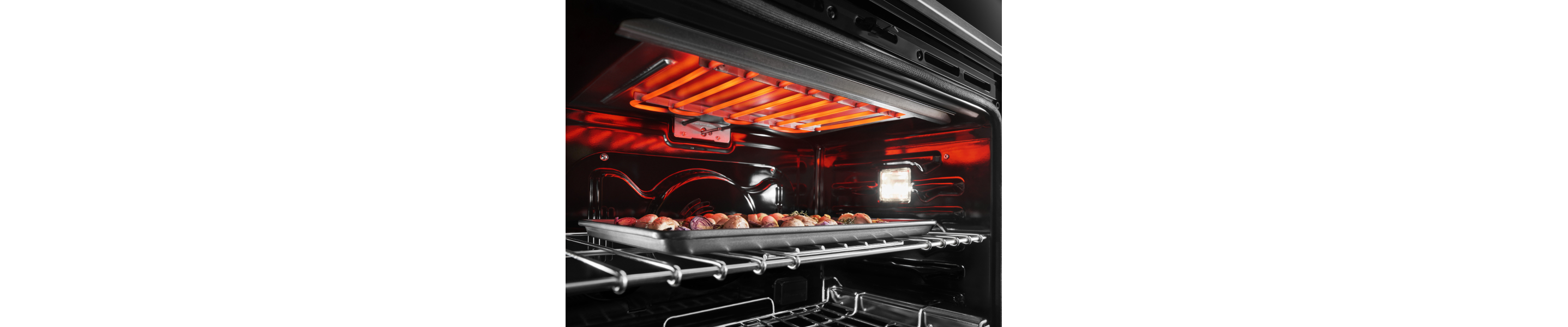 Potatoes broiling inside an oven