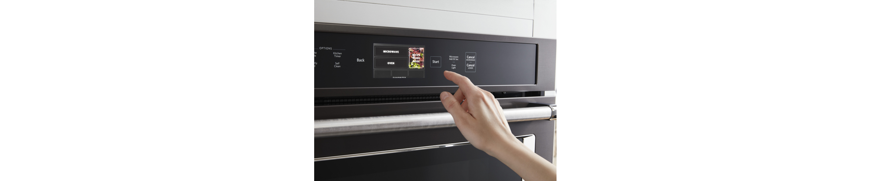 Person selecting a cook setting on a KitchenAid® oven control panel