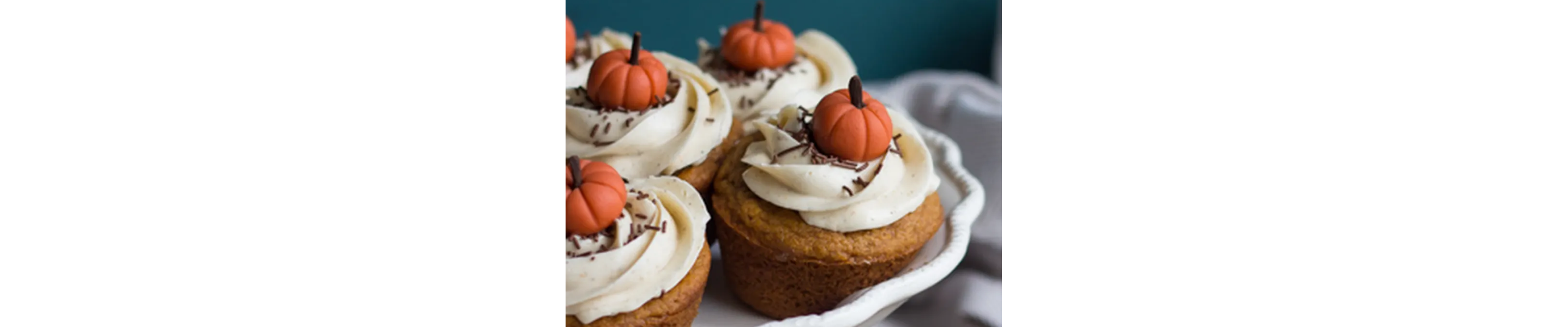 Close-up of pumpkin chai cupcakes with pumpkin candies on top
