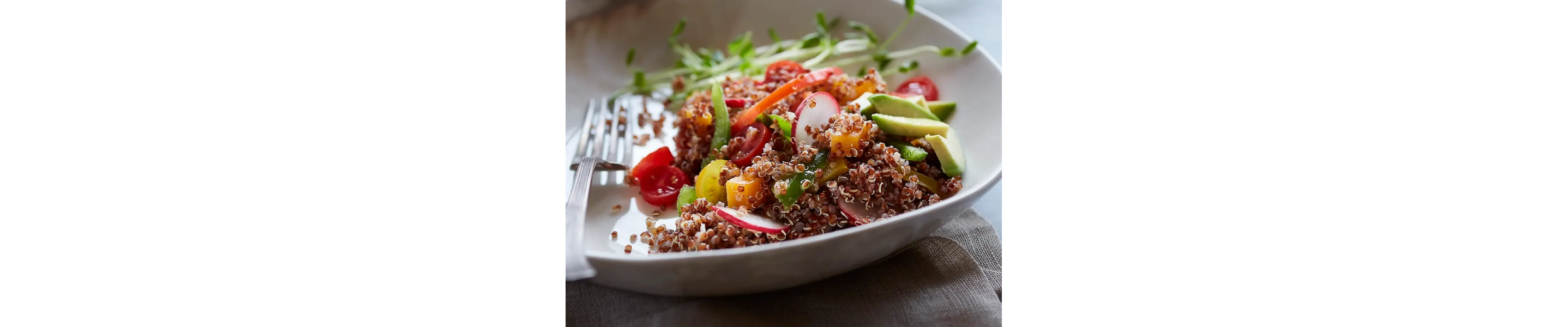 Close-up of quinoa salad with fruits and vegetables