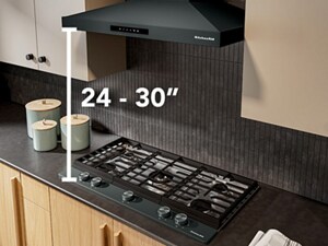 Diagram overlay of height recommendation for range hood above gas cooktop
