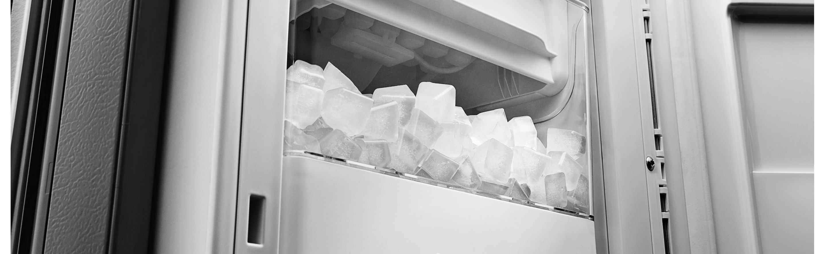 Full ice bin inside refrigerator freezer