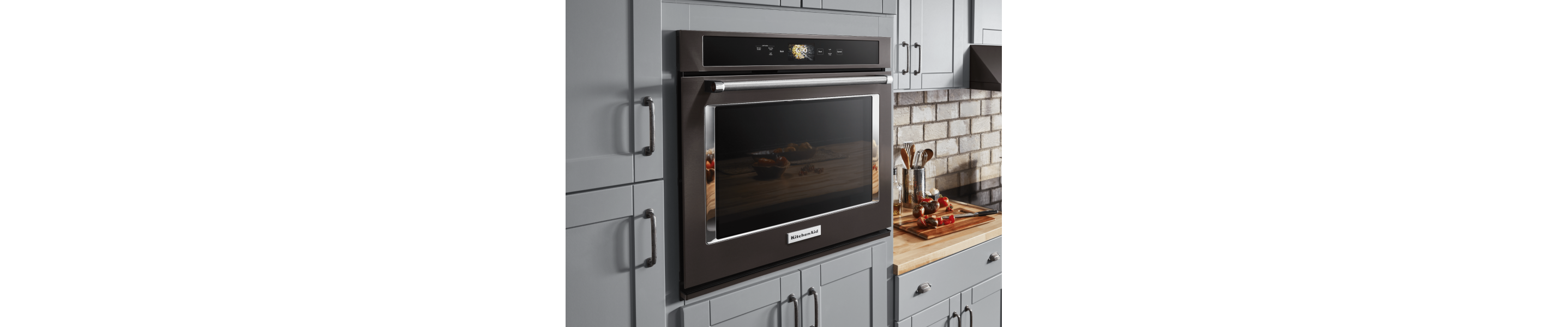 KitchenAid brand single wall oven in gray cabinetry