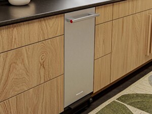 Stainless steel trash compactor installed under a counter