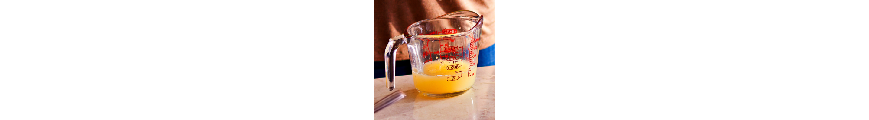  Clarified butter in a glass measuring cup