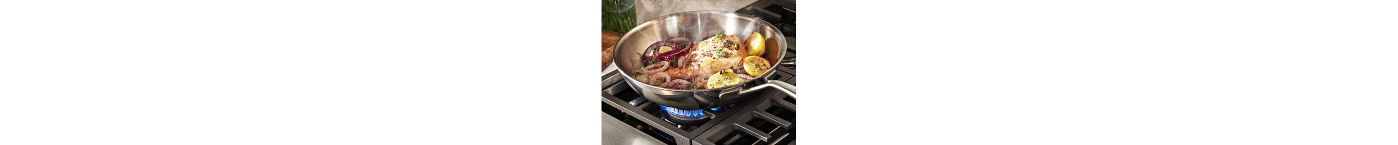 Food in a pan over gas burner