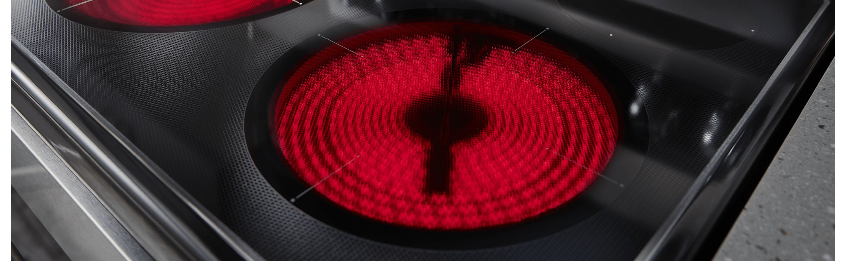 Close-up of an electric stovetop burner red with heat