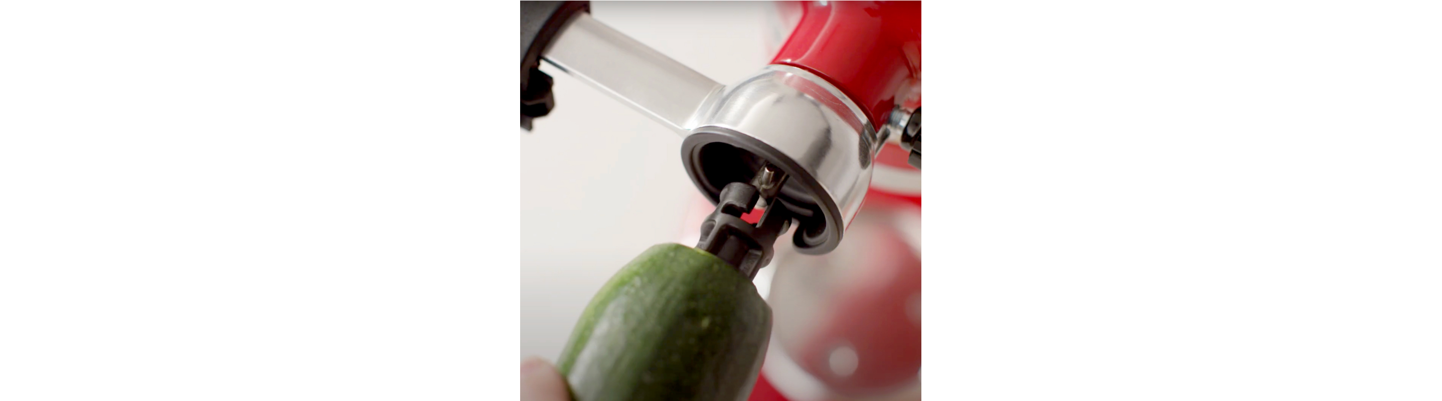 Zucchini inserting into the Vegetable Sheet Cutter food holder