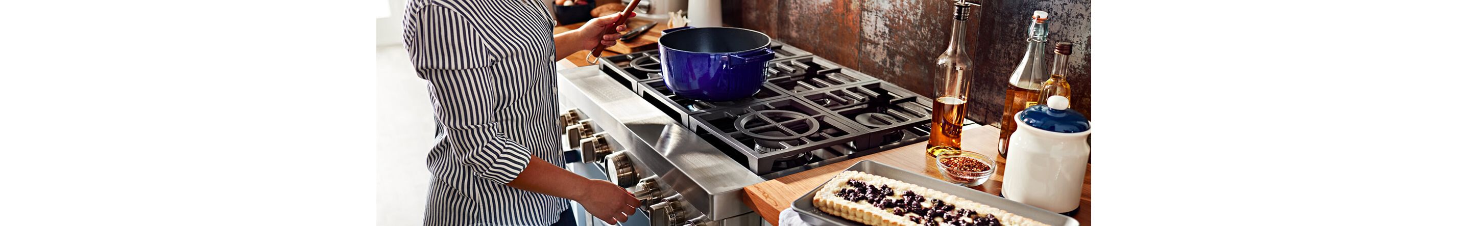 Person cooking on a gas range