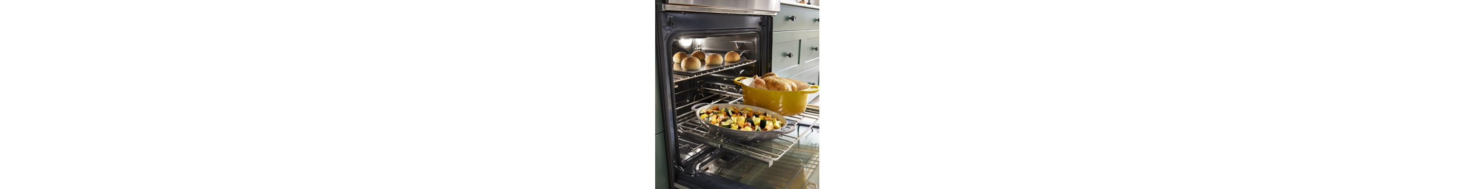 Multiple food items on the rack of a KitchenAid® range