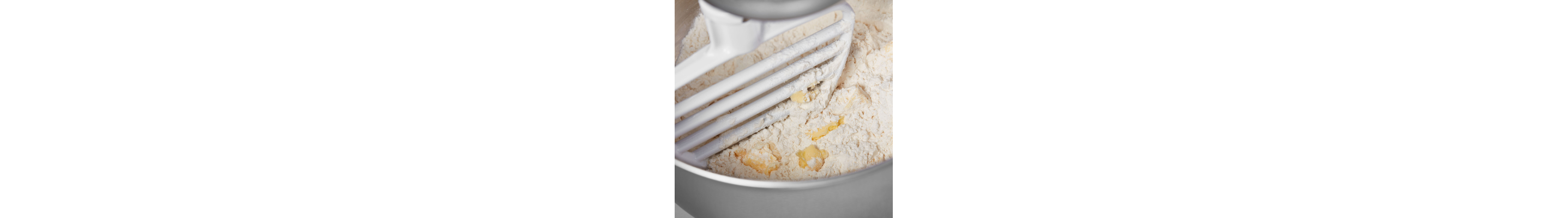 KitchenAid®  Pastry Beater cutting butter into flour