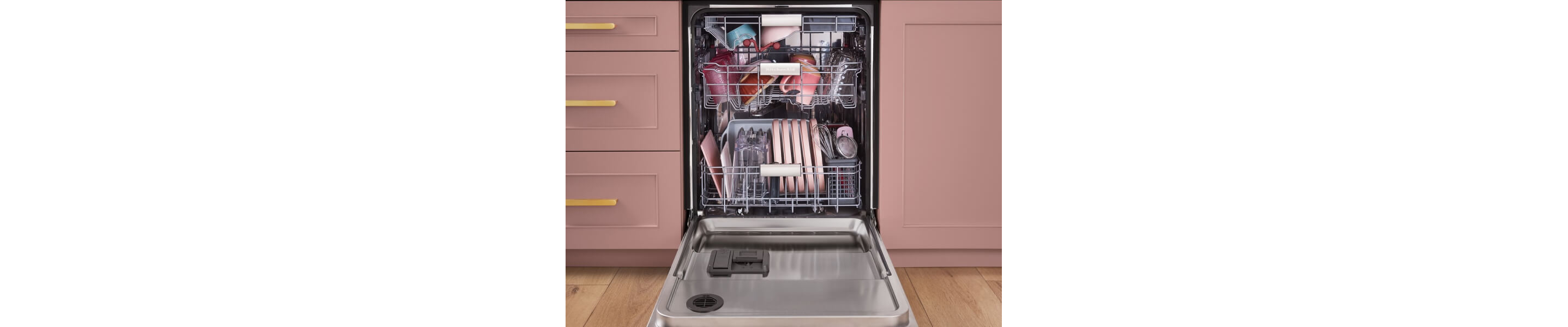 Dishes loaded into all three racks of an open dishwasher