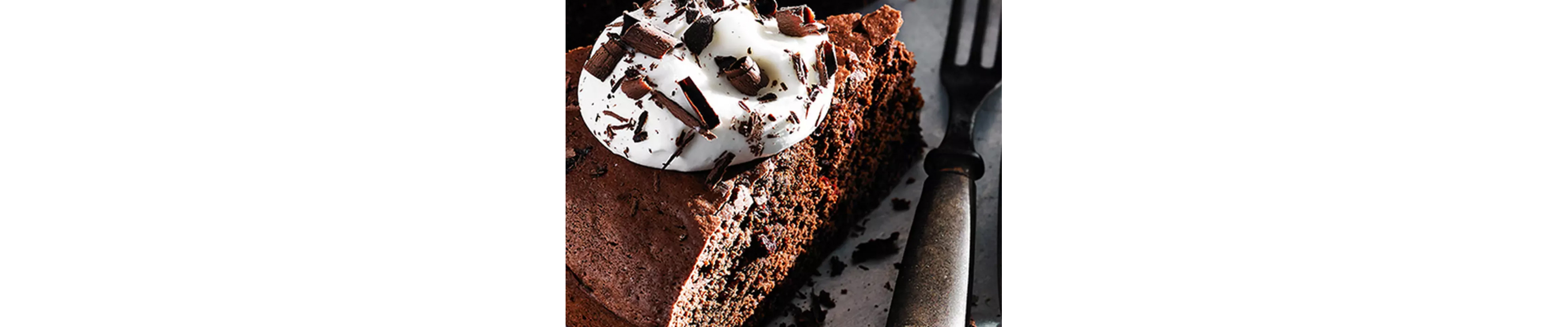 Chocolate dessert with whipped cream and chocolate shavings
