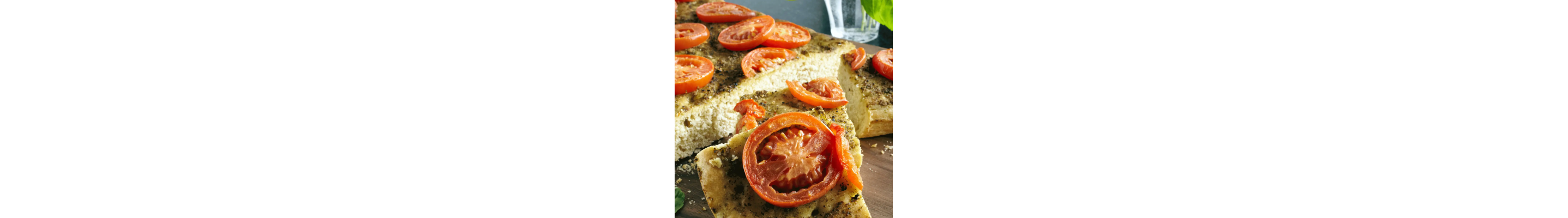 Focaccia topped with sliced tomatoes