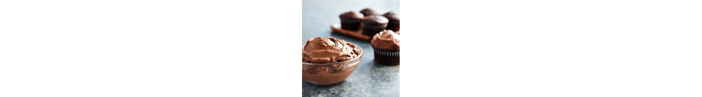 Espresso buttercream frosting in a glass bowl