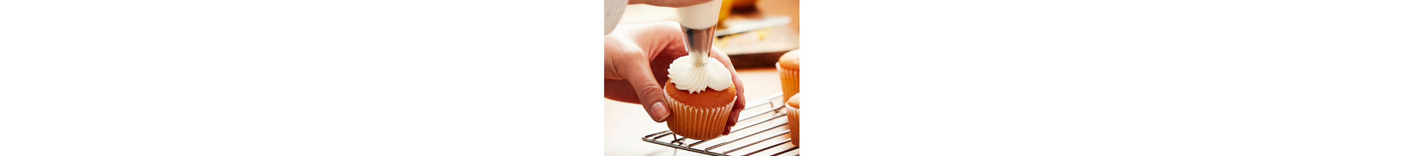 Cream cheese frosting piped onto a cupcake