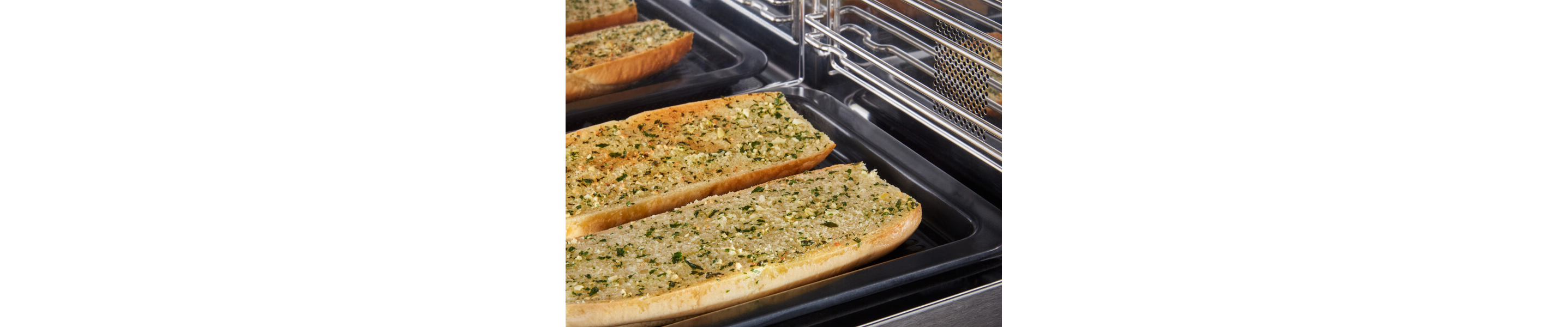 Close-up of garlic bread cooking in a microwave