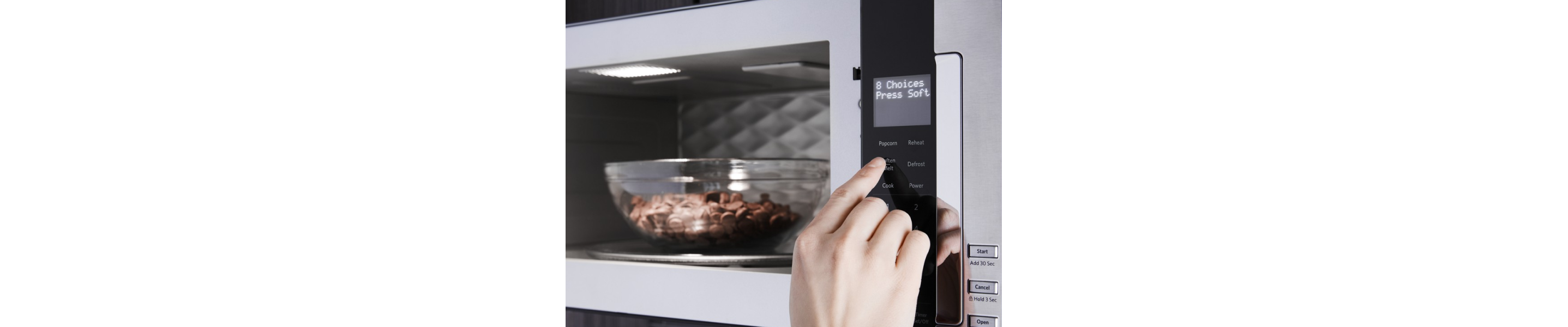 Person selecting settings to melt chocolate chips in the microwave