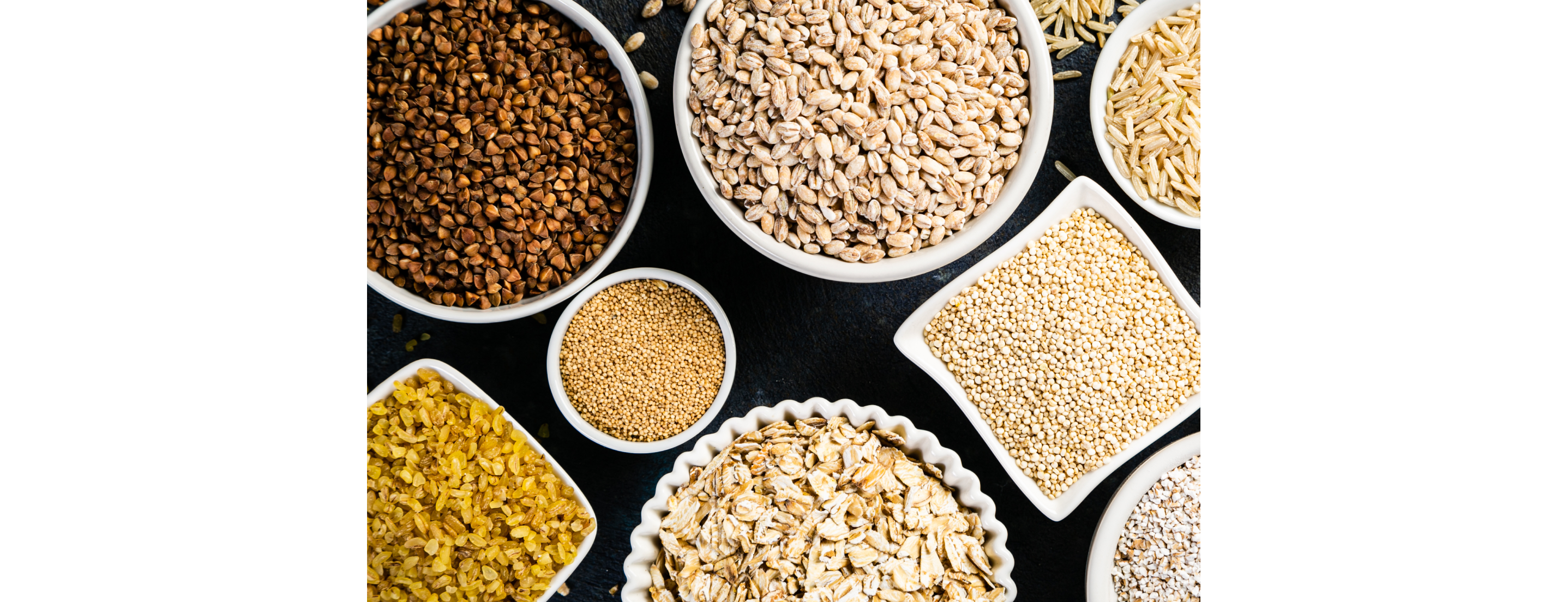 Several bowls filled with beans and grains