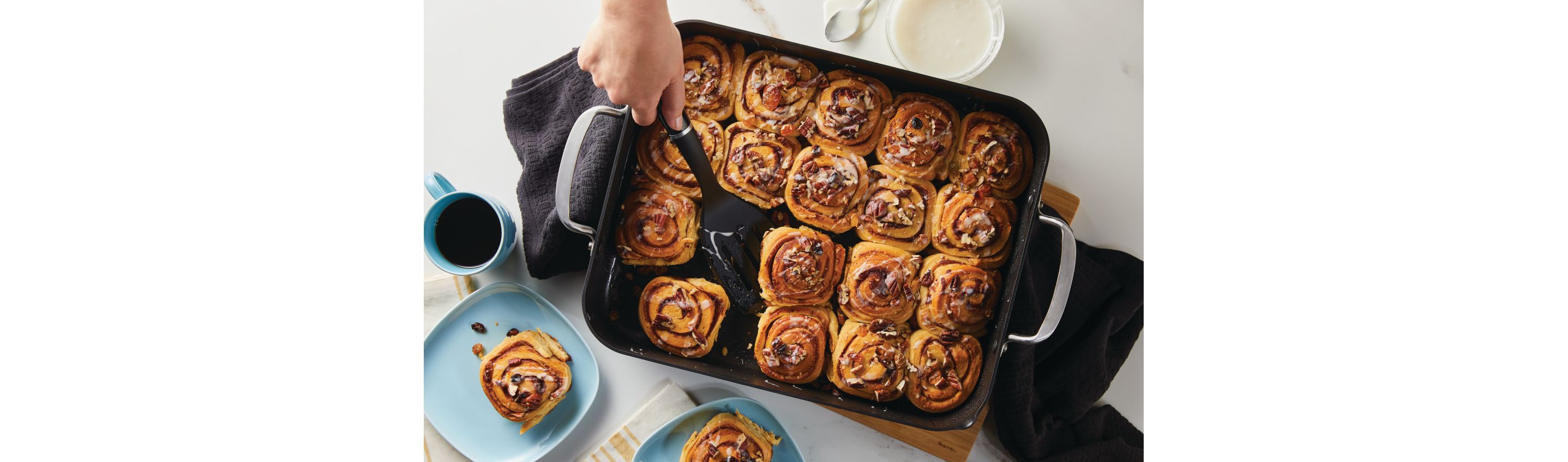 Preparing cinnamon rolls in a KitchenAid® Roasting Pan