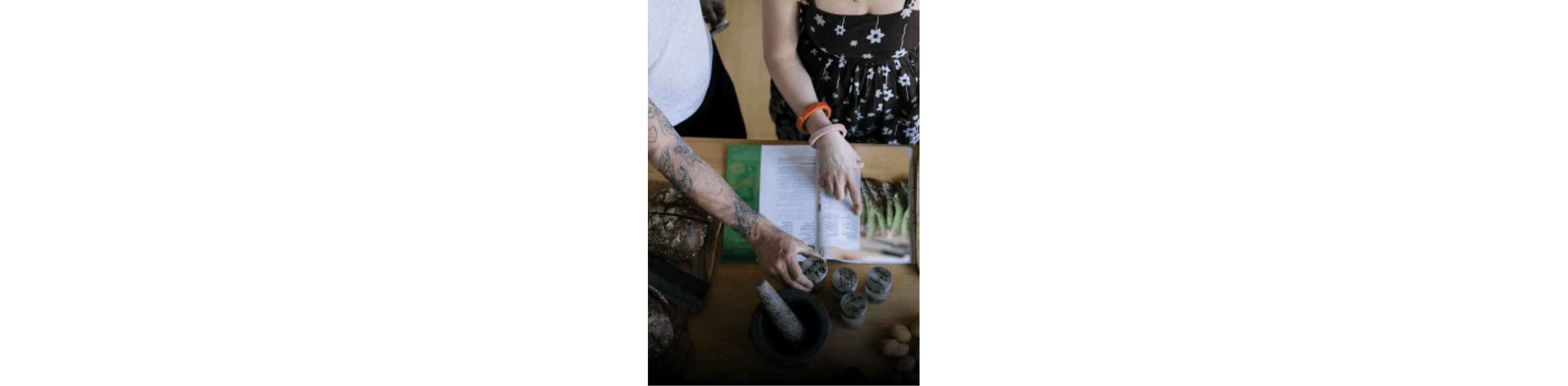 People looking at cookbook