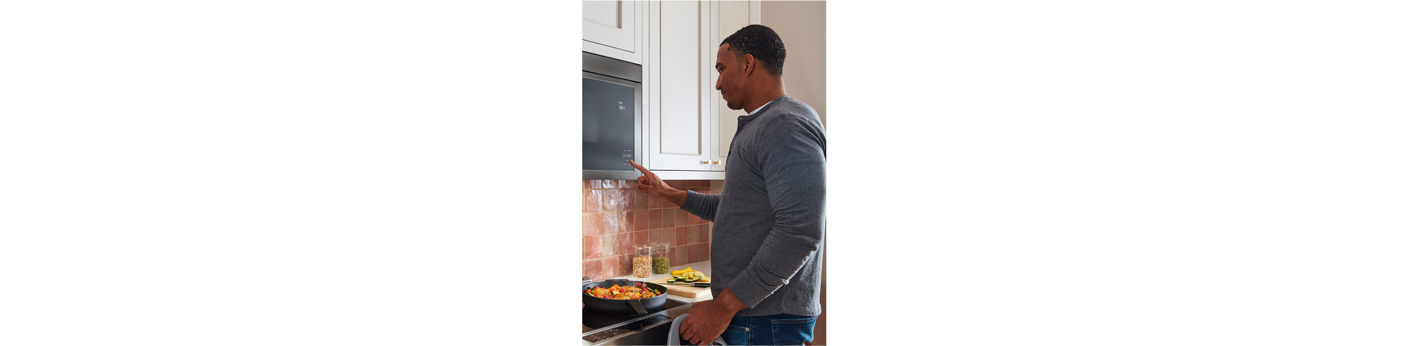 Man using KitchenAid microwave
