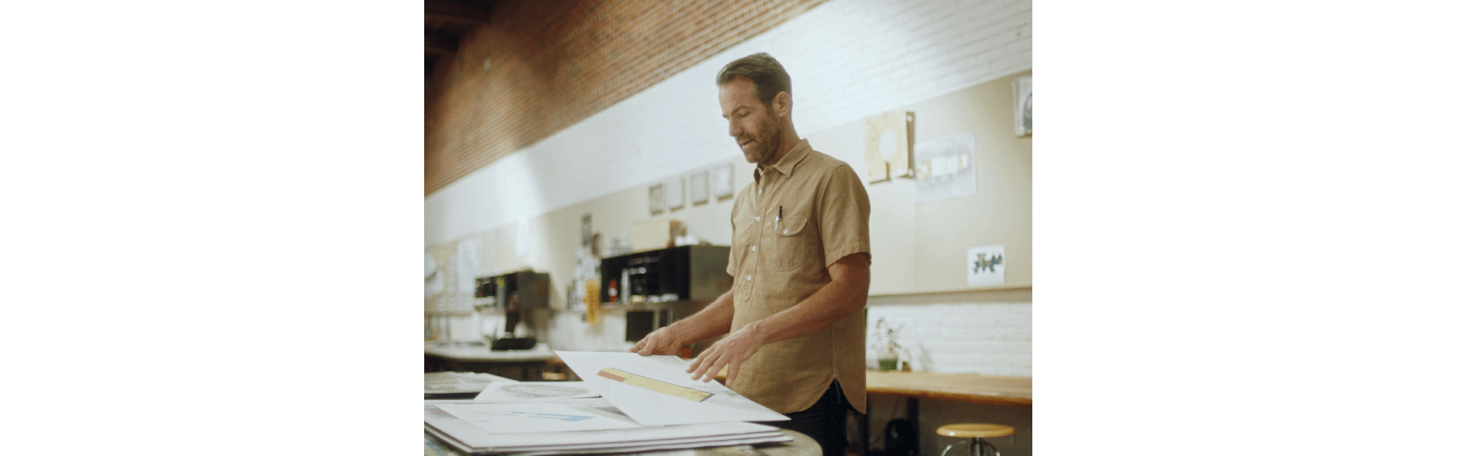 Mike Moore reviewing his work.