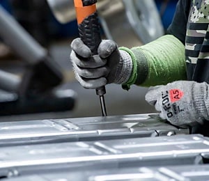 A person assembling an appliance